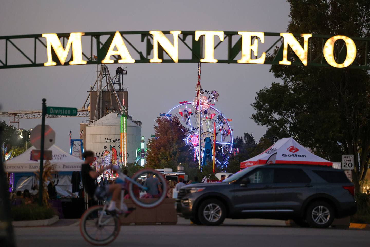 Carnival rides glow along Main Street in Manteno as the community gathered for the 27th annual Manteno Oktoberfest on Friday, Sept. 26, 2025.