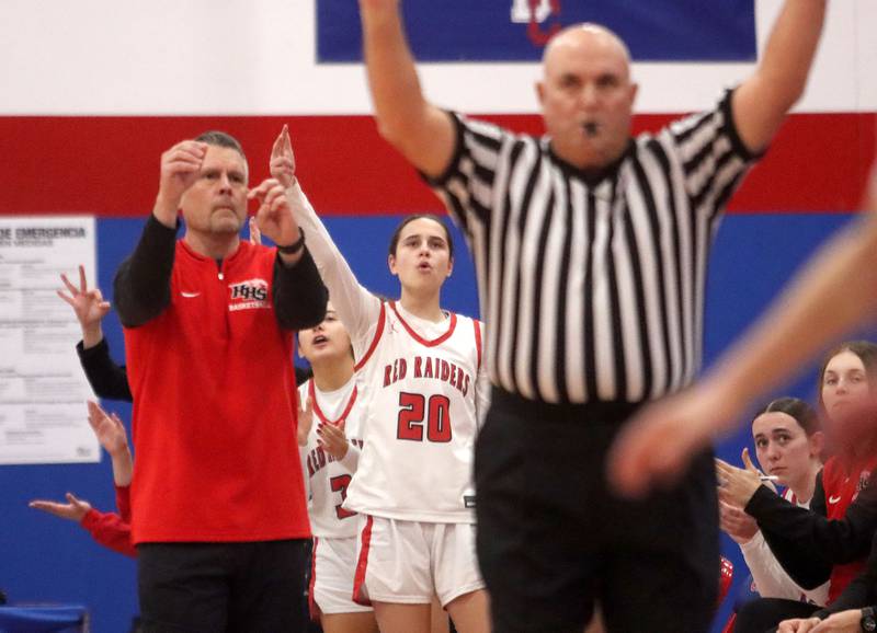 Huntley’s players and coaches react to a Kara Giordano  three-point basket against Mundelein in varsity girls basketball Komaromy Classic tournament  action on Tuesday, Dec. 30, 2025, at Dundee-Crown High School in Carpentersville.