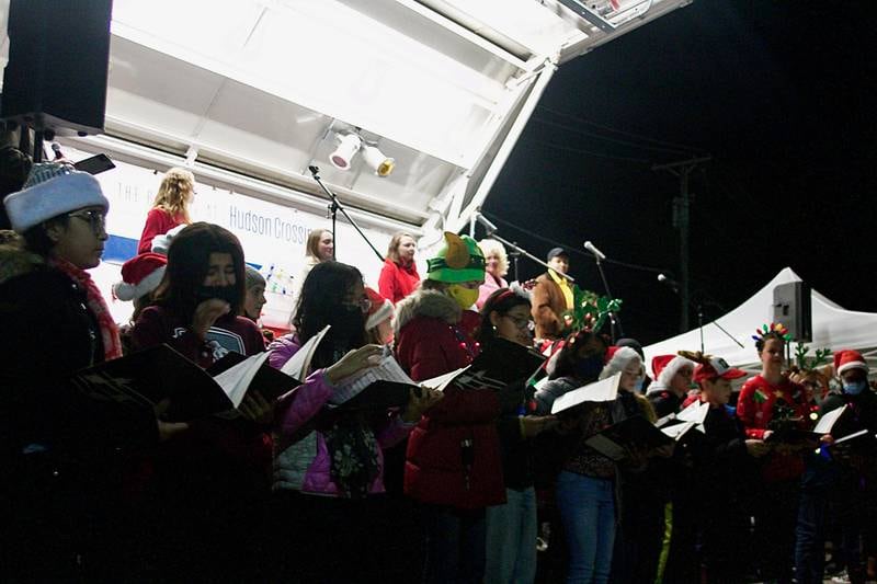 The Bednarcik Junior High School choir helped bring the holiday spirit to downtown Oswego Dec. 3, with a performance during the tree lighting ceremony, as part of the Christmas Walk festivities.