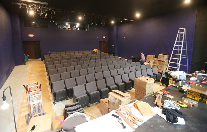 New seats are installed on Monday at Stage 212 in La Salle. Other renovation work at the theater includes a new stage curtain, acoustic panels for the walls, ceiling repairs, HVAC improvements, sound enhancements and lighting upgrades and painting.