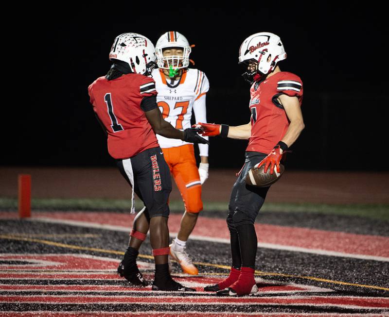 Bradley-Bourbonnais' Issac Allison, right, and Kyren Edmon, left, celebrate a touchdown by Allison in a Class 6A playoff game against Shepard on Friday, October 31, 2025.