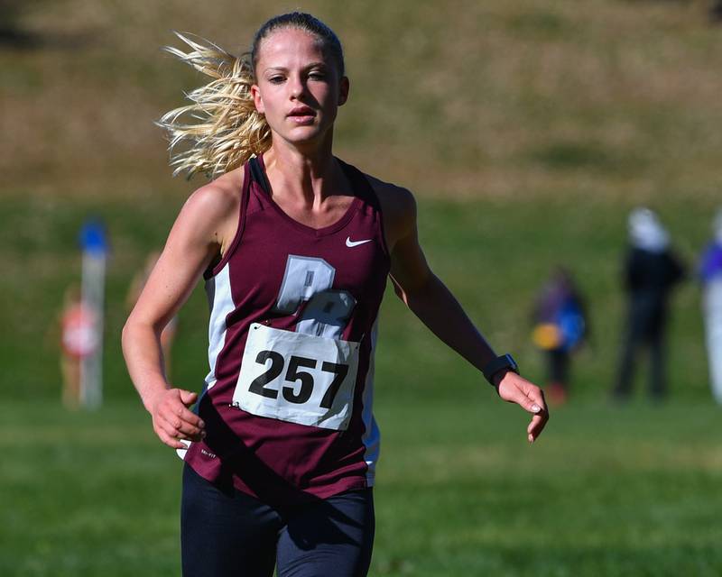 Prairie Ridge's Rachel Soukup heads for the finish line to finish first in the Fox Valley Conference girls cross country meet at Veteran Acres Park on Saturday, Oct. 15, 2022 in Crystal Lake.