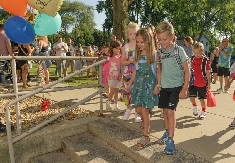 Students arrive at Davis Elementary in St. Charles for the start the 2025-2026 school year on Wednesday, Aug 13, 2025.