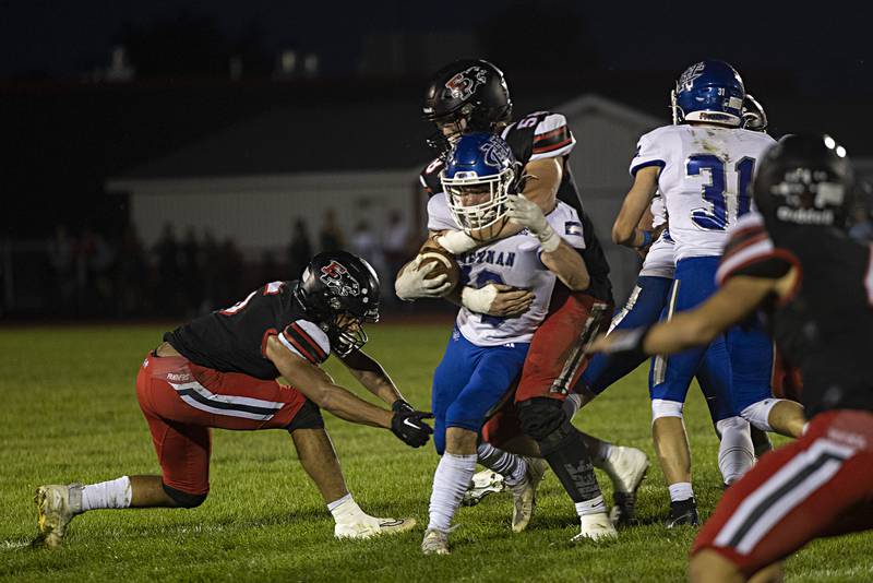 Newman’s Brady Grennan is wrapped up by Erie-Prophetstown’s Jordee Crow Friday, Sept. 22, 2023 in a game at Erie.