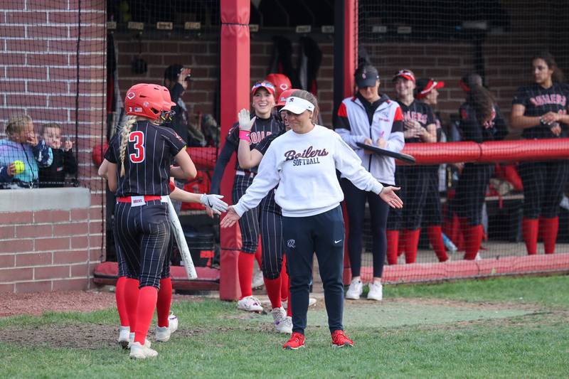 Bradley-Bourbonnais head coach Haylee Beck high fives players after scored runs during the Boilermakers' 8-0 victory over Normal Community in the IHSA Class 4A Bradley-Bourbonnais Regional semifinal on Tuesday, May, 27, 2025.