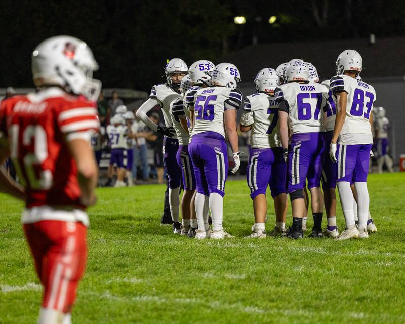 Dixon players huddle before play on Friday, October 17, 2025 at Streator High School in Streator.