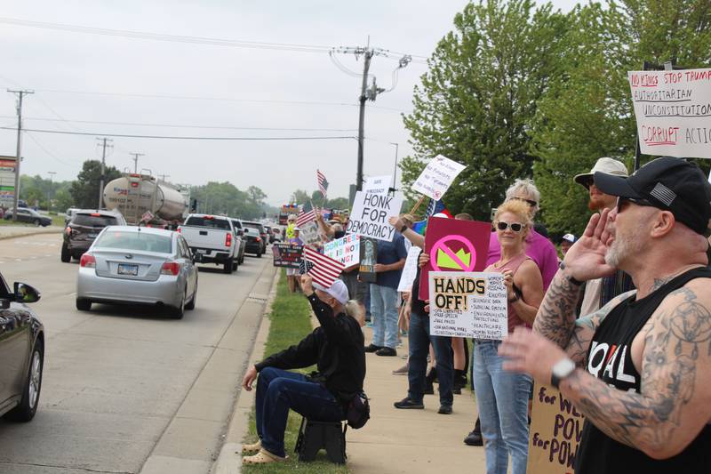 Thousands of protesters line up along Route 31 on June 14, 2025 during a "No Kings" protest in McHenry.