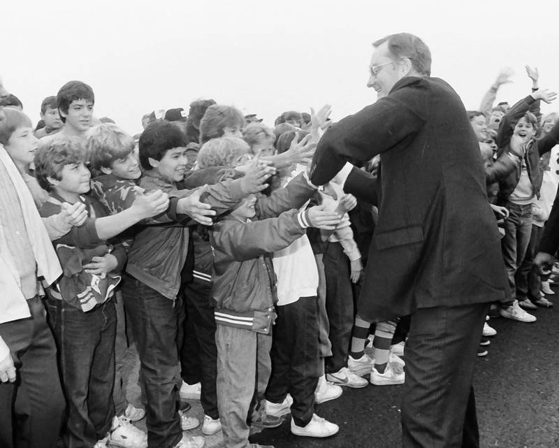 Young members of the crowd reach out to shake former Illinois Gov. Jim Thompson's hand as he arrives on stagecoach on Friday, Oct. 18, 1985 in Mendota. The ceremony commemorated the opening of Interstate I-39 between Mendota and Rochelle.