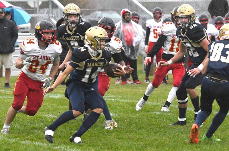 Polo's Jordan Reed (14) looks for yards as he runs for a gain against St. Anne during I8FA playoff action on Saturday, Nov. 8, 2025 at Polo High School. The Marcos won the game