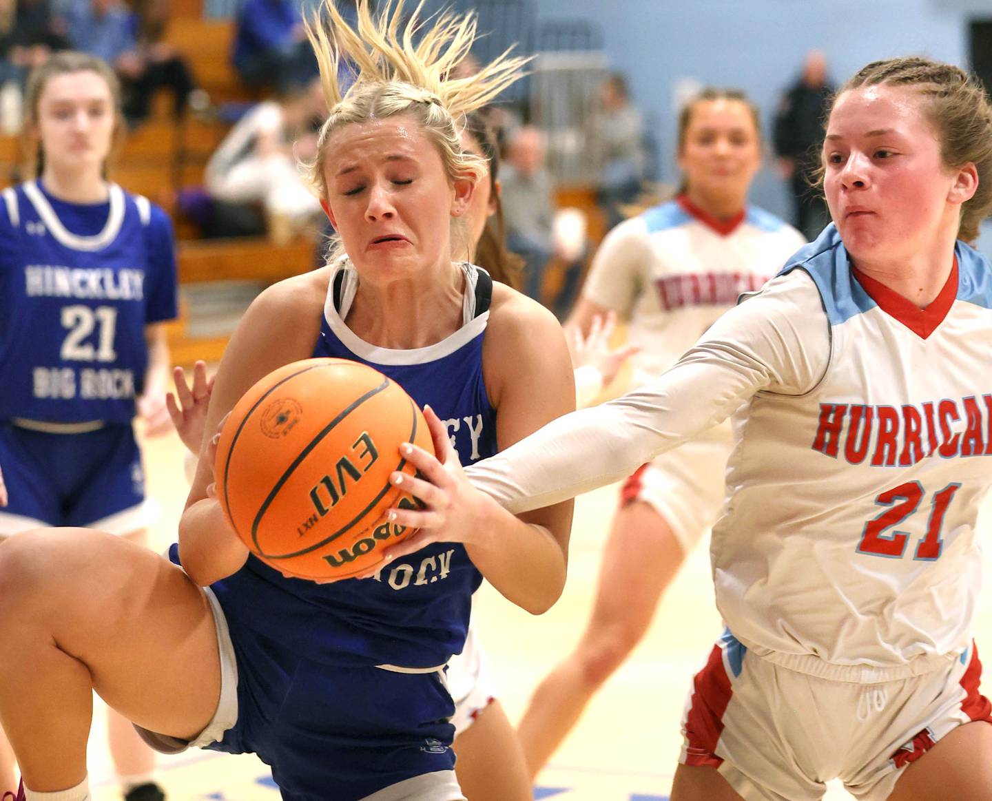 Hinckley-Big Rock's Anna Herrmann (left) and Marian Central's Lainey Remke go after a loose ball Monday, Feb. 16, 2026, during their regional semifinal game at Hinckley-Big Rock High School.