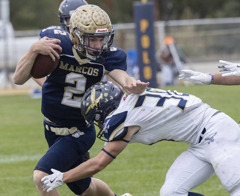 Polo’s JT Stephenson fight for yards against Hiawatha’s Tim Pruitt Saturday, Nov. 1, 2025, in the 8-man football playoff quarterfinals.