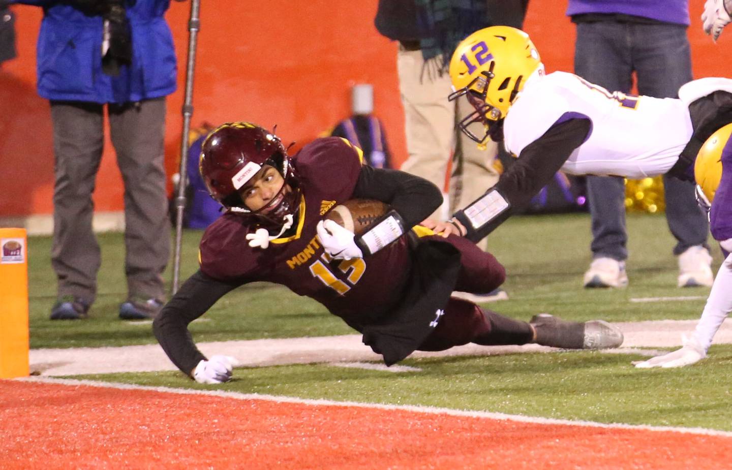 Montini Catholic's CJ Harkins eyes the end zone as Monticello's Colton Shubert brings him down short of the goaline during the Class 3A State football championship on Friday, Nov. 29, 2024 at Hancock Stadium in Normal.
