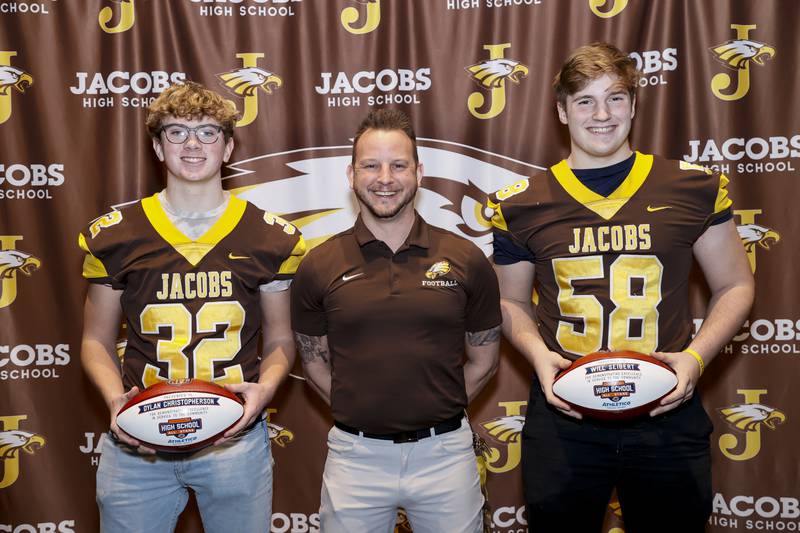 Jacobs' Dylan Christopherson (left), coach Brian Zimmerman and Will Seibert (right) after Christopherson and Seibert were honored as Bears' Community High School All-Stars on March 7. Zimmerman nominated his two junior players for the award.