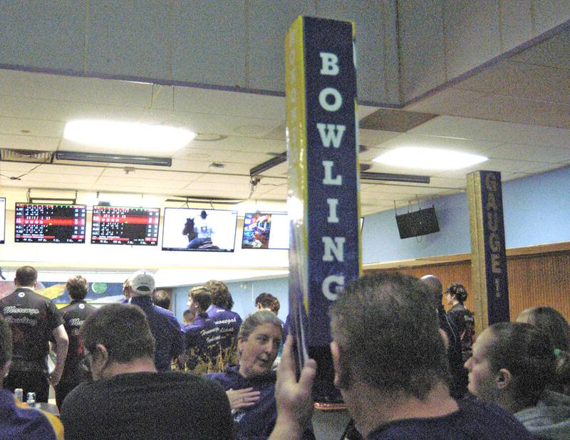 A Dixon fan uses a periscope to watch bowling action Saturday at Plum Hollow. Oregon hosted the boys bowling sectional Saturday, Jan. 25, 2025 at Plum Hollow in Dixon.