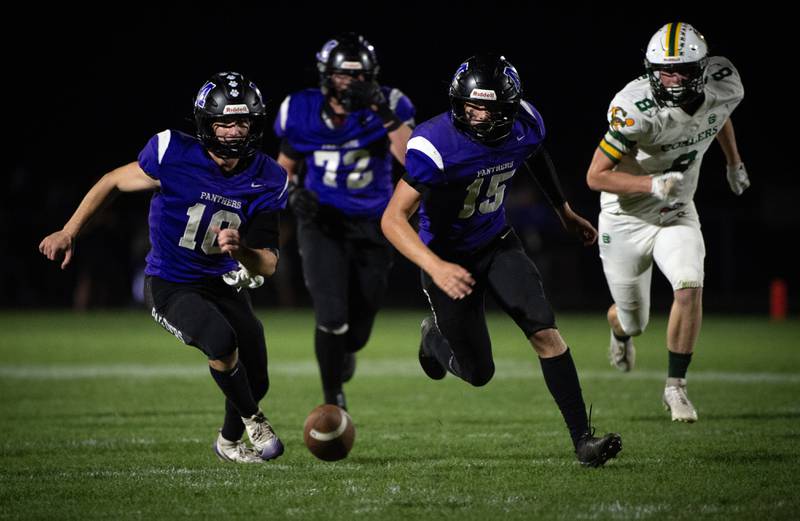 Manteno's Connor Harrod, left, and Nicholas Honkisz, center, look to try and recover a fumble in a game against Coal City on Friday, October 3, 2025. Coal City recovered the fumble.