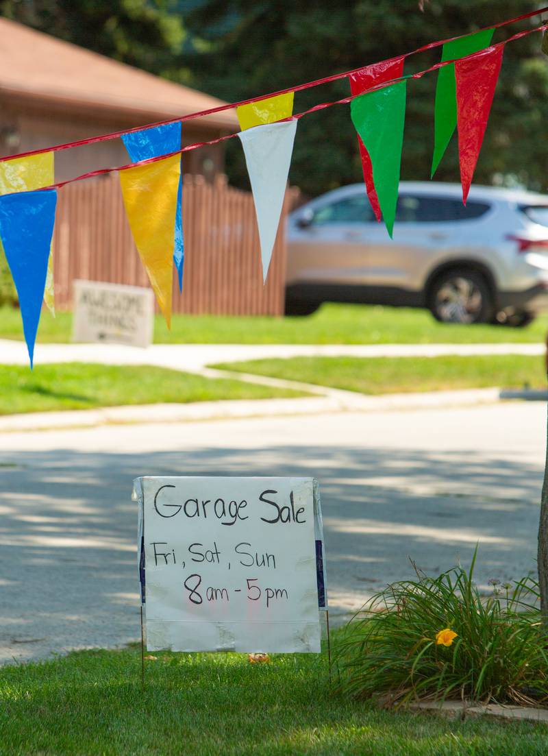 Garage sale signs lined some of the lawns of Westmont during the town’s weekend garage sales, Sunday, August 4, 2024.