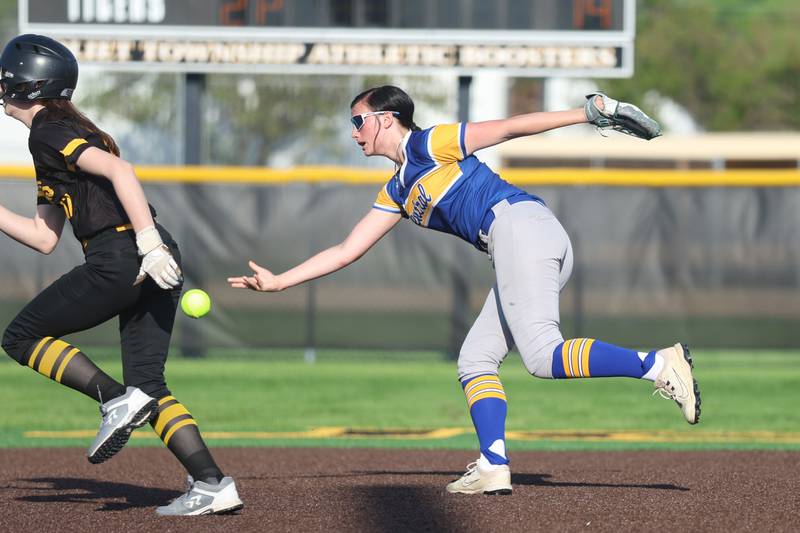 Joliet Central’s Riley Smith flips the ball to third for the out against Joliet West on Wednesday, April 22, 2026 in Joliet.
