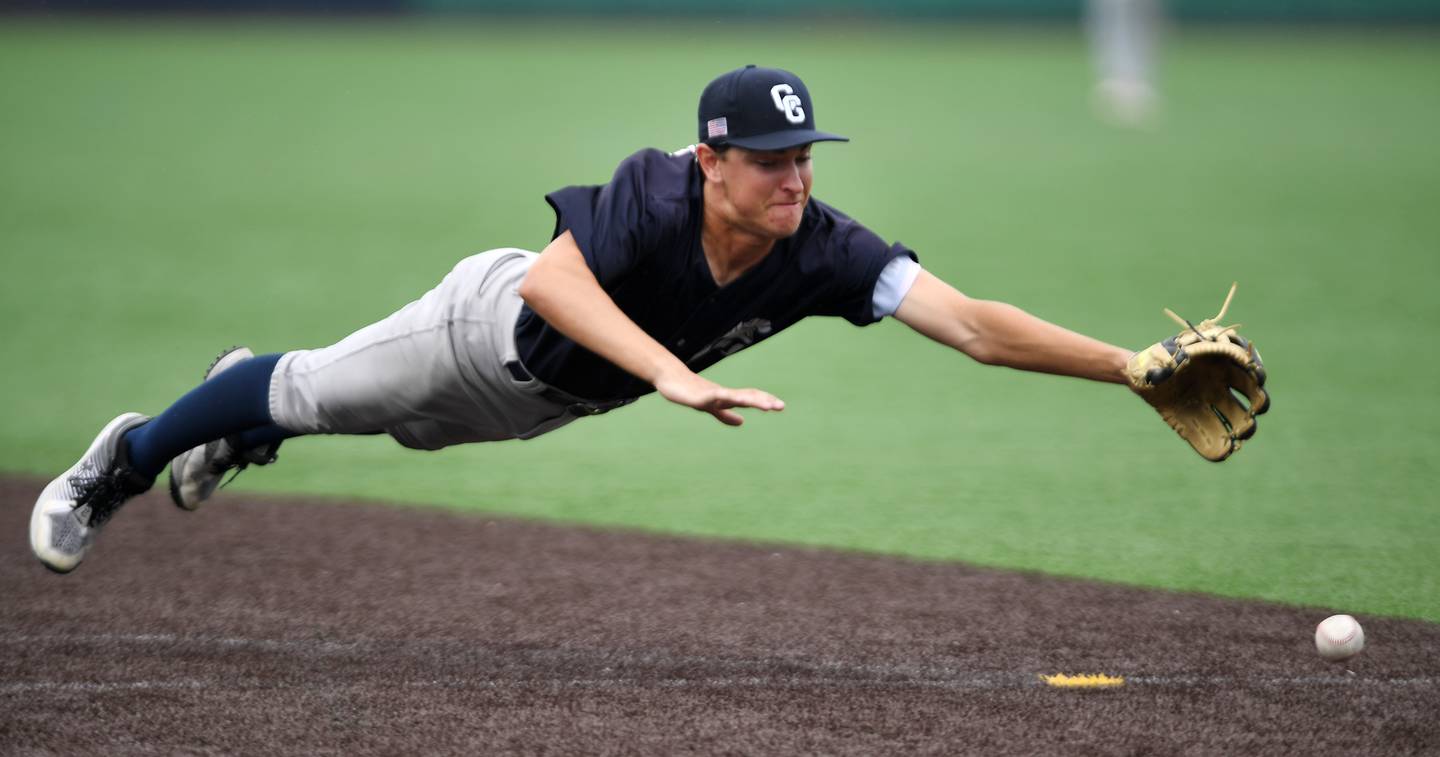 Cary-Grove second baseman Oskar Freund can’t get to a ball hit by Benet Academy Luke Wildes during the Class 3A state baseball semifinal at Slammers Stadium on Friday, June 13, 2025 in Joliet.
