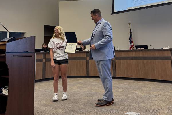 Morris congratulates 3-time IESA champion Caputo on track and field accomplishments