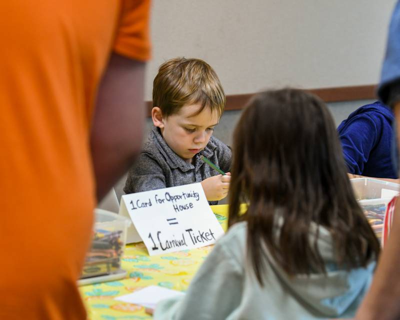 Judah Vargas, 4, of DeKalb makes a card for Opportunity House on Sunday Oct. 12, 2025, during the DeKalb County 4-H carnival held at the DeKalb.