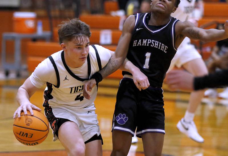 Crystal Lake Central's Carter Kelley, brings the ball up the court against Hampshire's Chayse Gray during a a Fox Valley Conference basketball game on Friday, Feb. 7, 2025, at Crystal Lake Central High School.