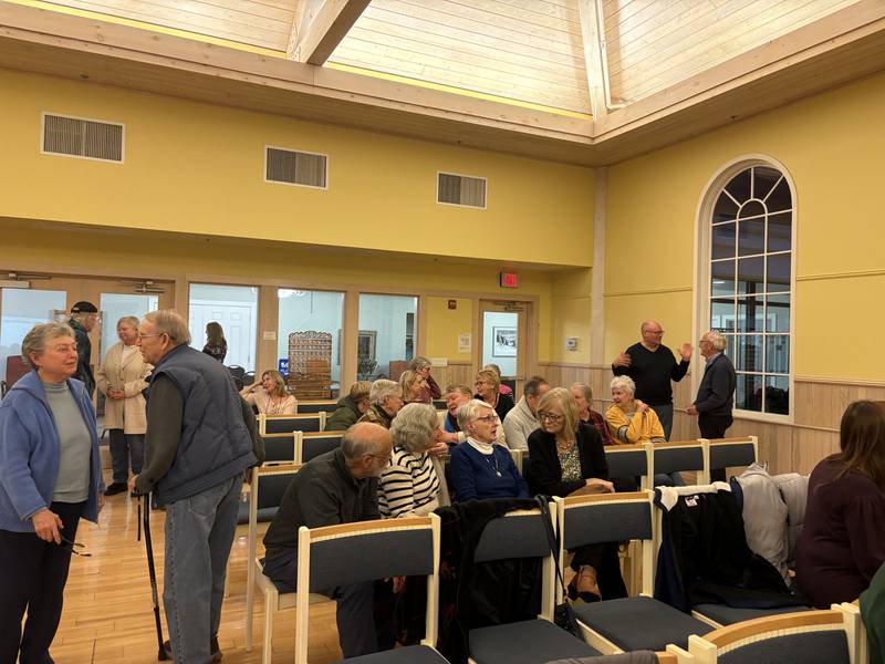 Audience members talk during FaithBridge's Thanksgiving program Nov. 23, 2025 in Crystal Lake.