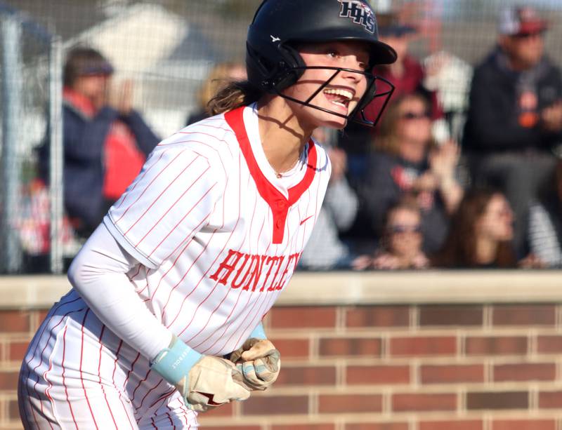 Huntley’s Grace Benson  gets revved up after scoring against Prairie Ridge in varsity softball at Huntley High School in Huntley on Monday, May 5, 2025.