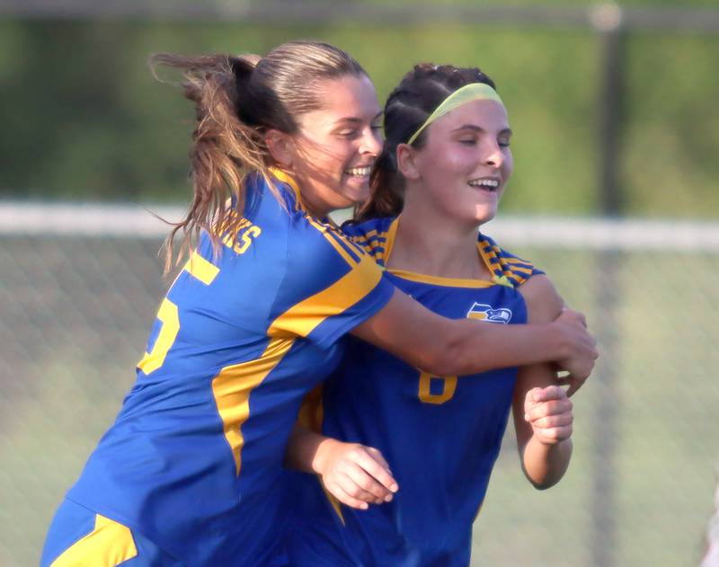 Johnsburg’s Liz Smith, right, is embraced by Lauren McQuiston after Smith scored the Skyhawk’s fourth goal of the game against North Shore Country Day in IHSA Class 1A Sectional Title Game action at Richmond-Burton High School in Richmond on Tuesday, May 27, 2025.