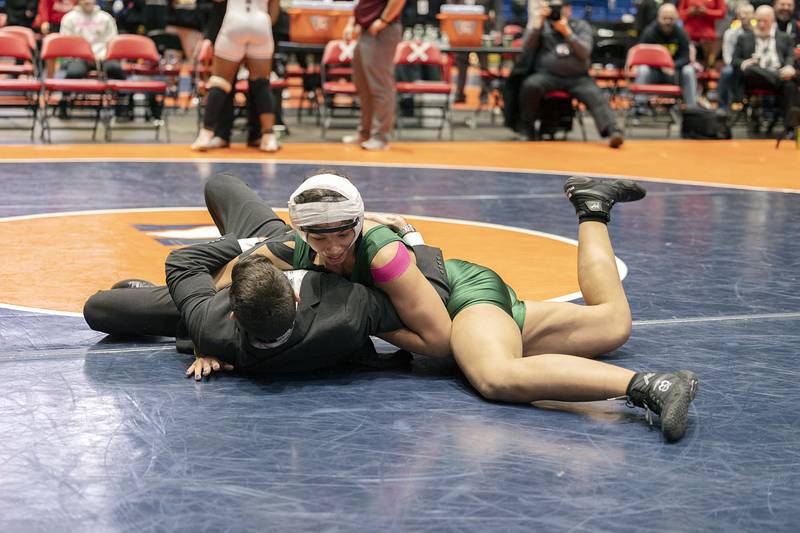 Alicia Tucker of Plainfield celebrates her title by slamming her coach at the IHSA girls state wrestling championships Saturday, Feb. 25, 2023.