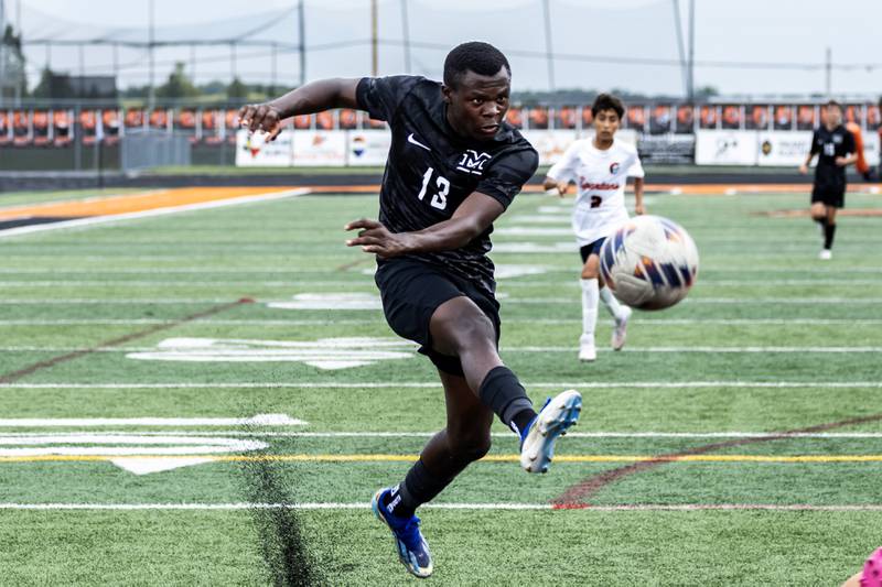 Minooka's Brian Ngong attempts a goal during a varsity soccer home game against Romeoville on Sept. 23, 2025.