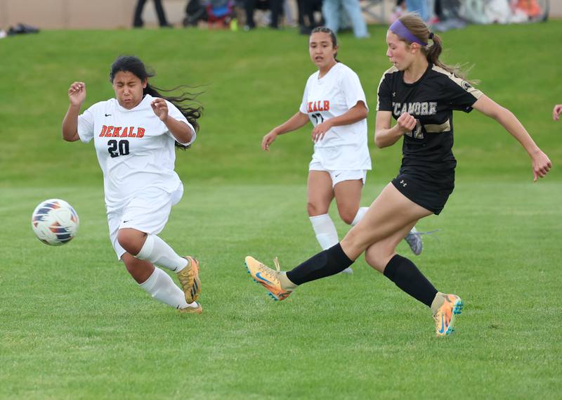 Sycamore's Addison Rodriguez takes a shot in front of DeKalb's Michelle Gamboa Thursday, May 7, 2026, during their game at Sycamore High School.