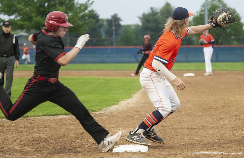 Yorkville hitter Ryan Buck arrives at the bag at the same time Oswego first baseman Hunter Stroud squeezes the ball. Buck was called out during a varsity boys baseball game on Wednesday, May 18, 2022 at Oswego High School.