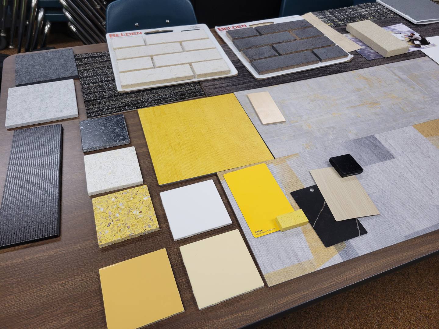 Examples of building materials including tiles, bricks and colors were shown to participants of a community meeting that gathered Thursday, Oct. 9, 2025, after a groundbreaking ceremony was held for the new Herscher Intermediate School.