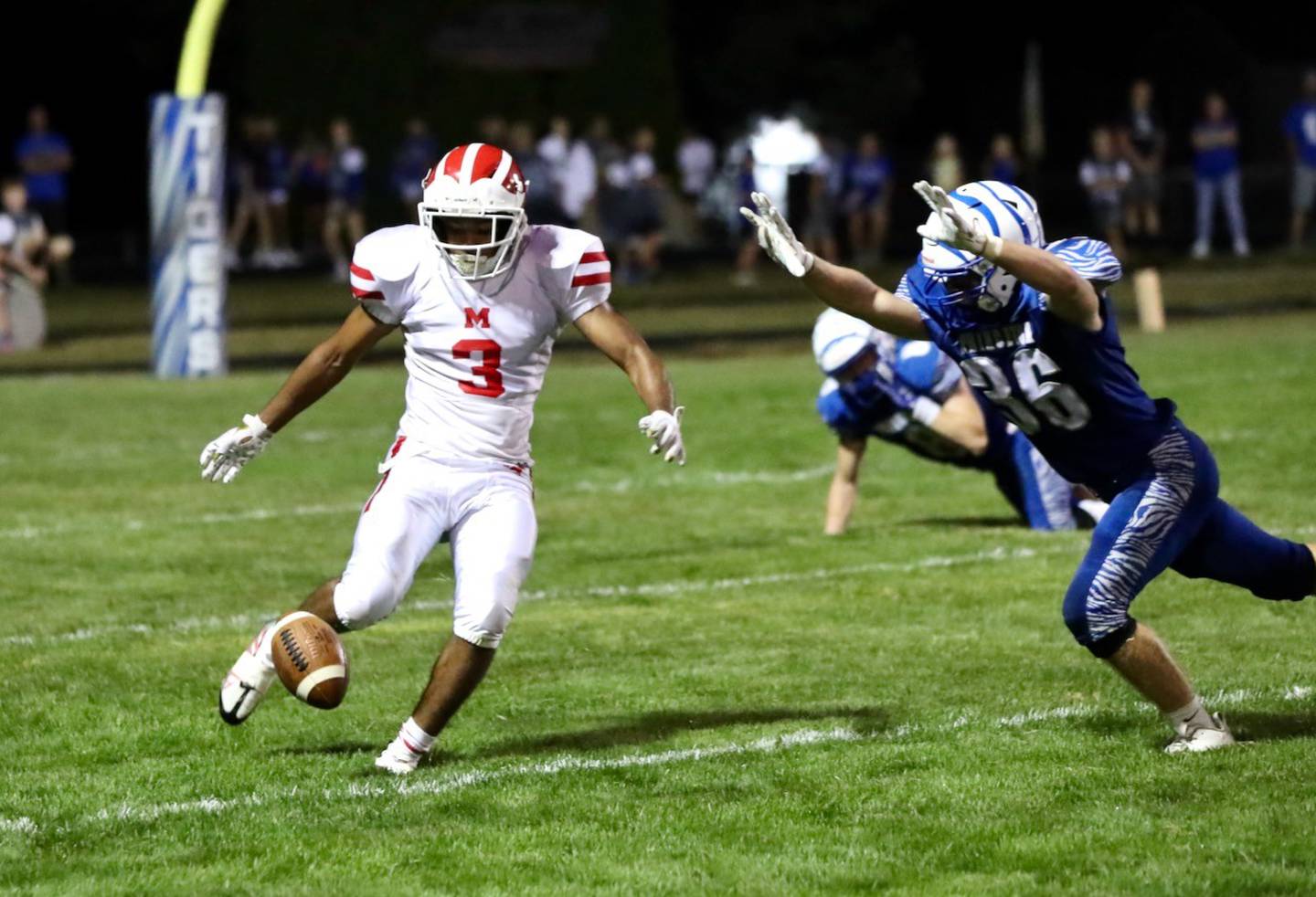 Princeton's Common Green tries to block a running punt by Morrison's Deshaun McQueen Friday at Bryant Field.