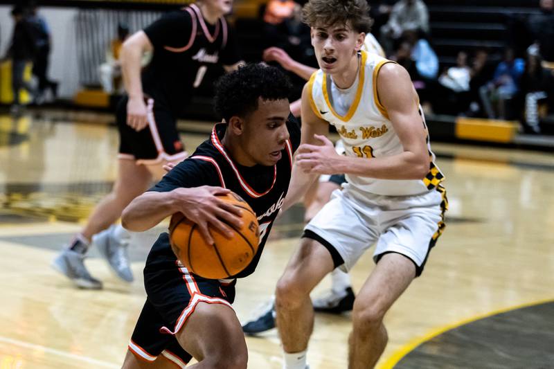 Minooka's Luke Page drives towards the basket during a varsity boys basketball game against Joliet West at Joliet West on Jan. 6, 2026.