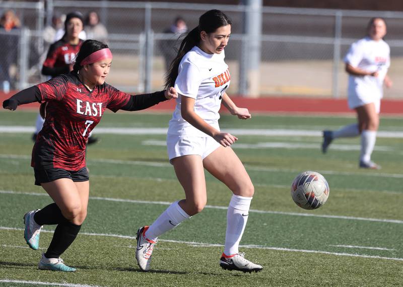 DeKalb's Ailany Padilla pushes the ball ahead of Rockford East's Ru Tha during their game Tuesday, March 25, 2025, in the Barb Fest tournament at DeKalb High School.