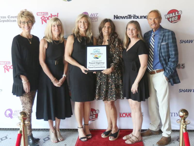 The staff with Travel Connections poses for a photo during the second annual Best of the Illinois Valley event on Thursday at the Auditorium Ballroom in La Salle.
