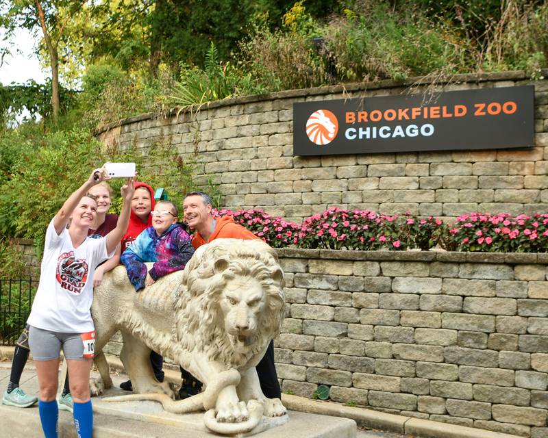 Robin Allen, left take a selfie photo with her family that also includes Lilly Adkins, 13, Paul Eckhart 10, Logan Eckhart, 9, and Dave Eckhart before the start of the Zoo Run on Sunday Sept. 9, 2024, held at Brookfield Zoo in Brookfield.