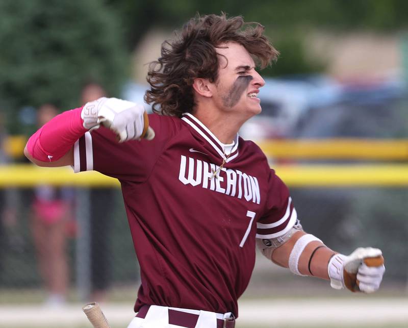 Wheaton Academy's Jacob York celebrates his RBI double during their Class 3A sectional semifinal against Sycamore Wednesday, May 29, 2024, at the Sycamore Community Sports Complex.