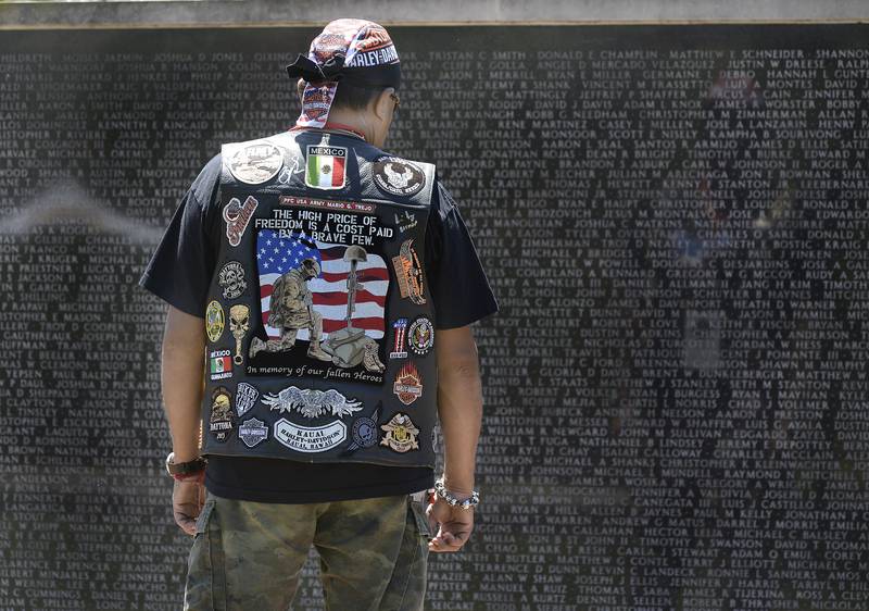 Many veterans who attended the ceremony at the Middle East Conflicts Wall on Saturday, June 18, 2022, in Marseilles searched for those they knew who lost their lives in action.