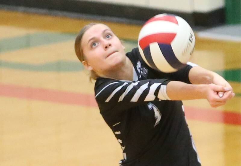 Kaneland's libero Madeline Moses bumps the ball back to the L-P side of the net in AJ Sellett Gymnasium on Thursday, Oct. 24, 2024 at L-P High School.