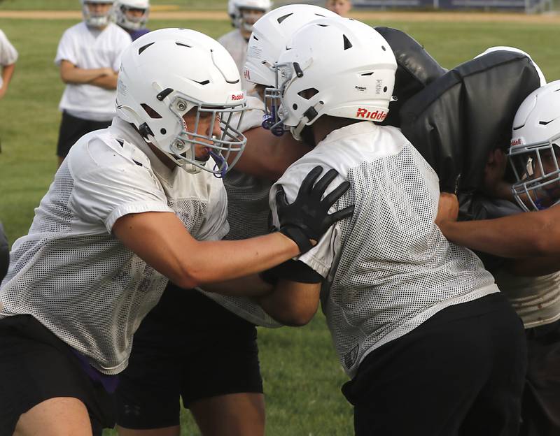 Hampshire’s Gage Homola blocks during the first day of football practice Monday, August 7, 2023, at Hampshire High School.
