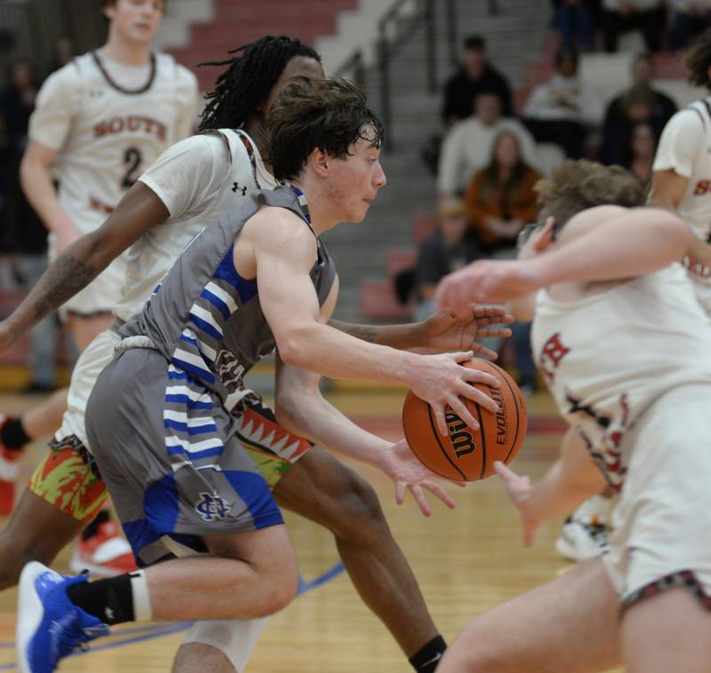 Sterling Newman's Garret Matznick (3) dribbles past South Beloit defenders during the championship game at the Oregon Thanksgiving Tournament on Saturday, Nov. 25, 2023 at the Blackhawk Center in Oregon.