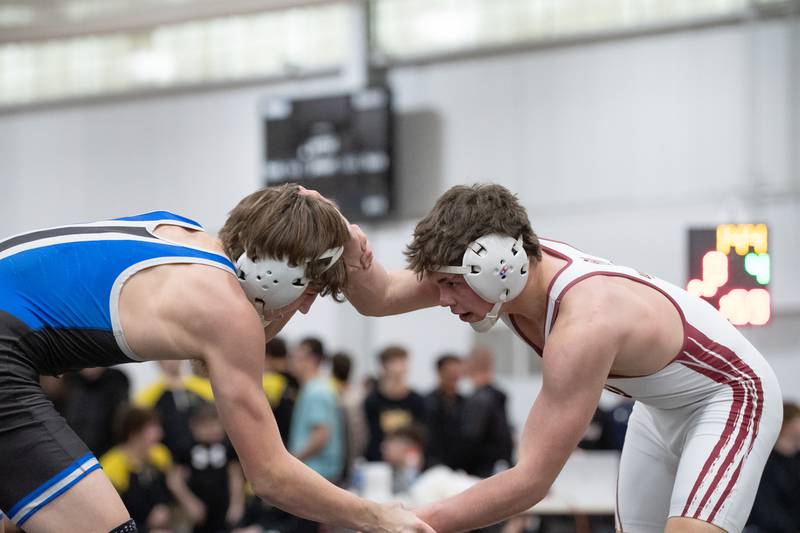Wheaton Academy's Lincoln Hoger, right, and Petersburg Porta's Zach Bryant wrestle in the 144-pound championship match during the Reed-Custer Comet Classic Wrestling Invite on Saturday, Jan 17.