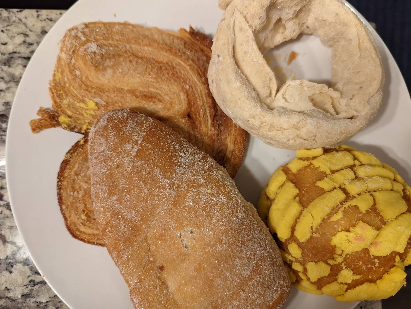La Chicanita Bakery in Crest Hill offers a wide variety of homemade breads and pastries, juices, sandwiches and custom cakes. Pictured, clockwise, is a palmier, fried dough, concha and a cream cheese-filled danish.