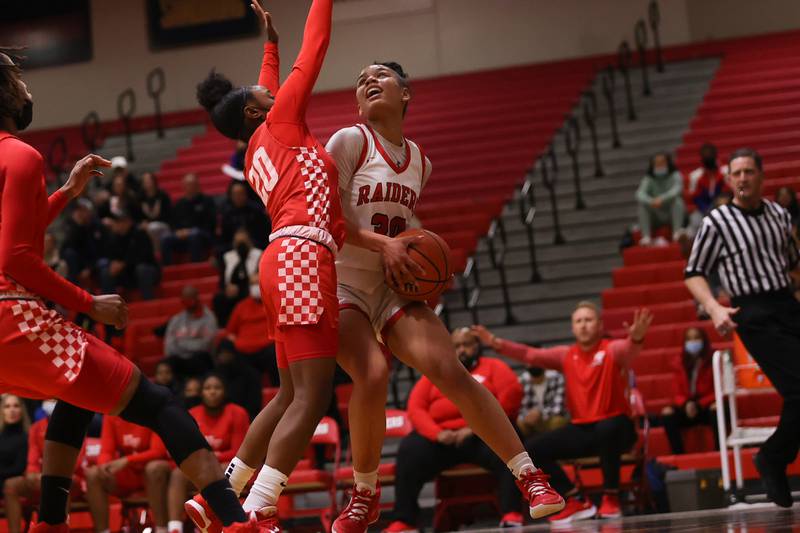 Bolingbrook’s Angelina Smith battles under the basket for a shot against Homewood-Flossmoor in the Class 4A Bolingbrook Sectional championship. Thursday, Feb. 24, 2022, in Bolingbrook.
