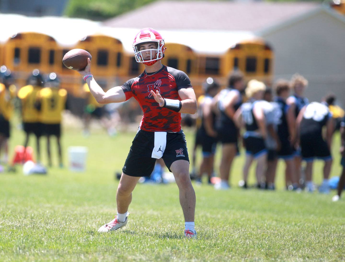 Hinsdale Central quarterback Riley Contreras fires the ball during a 7-on-7 tournament at Naperville North on Thursday, June 27, 2024.
