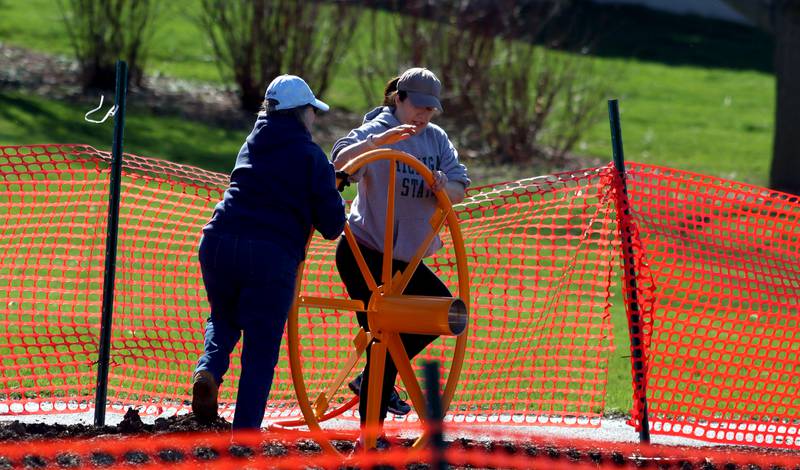 Volunteers and friends of Three Oaks Elementary School constructed a new playground at the Cary school on Saturday.