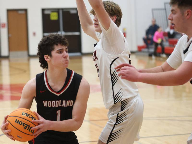Woodland's Brezdyn Simons looks to pass the ball around Indian Creek's Parker Murry during the Class 1A Sectional Semifinal game on Wednesday, March 4, 2026 at Amboy High School.
