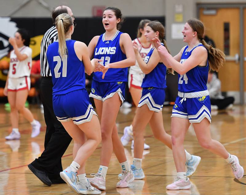 Lyons Township’s Emma O'Brien (second from left) celebrates with teammates after sinking two free throws to give the Lions a one point win over Benet ending a game on November 18, 2025 at Benet Academy in Lisle.